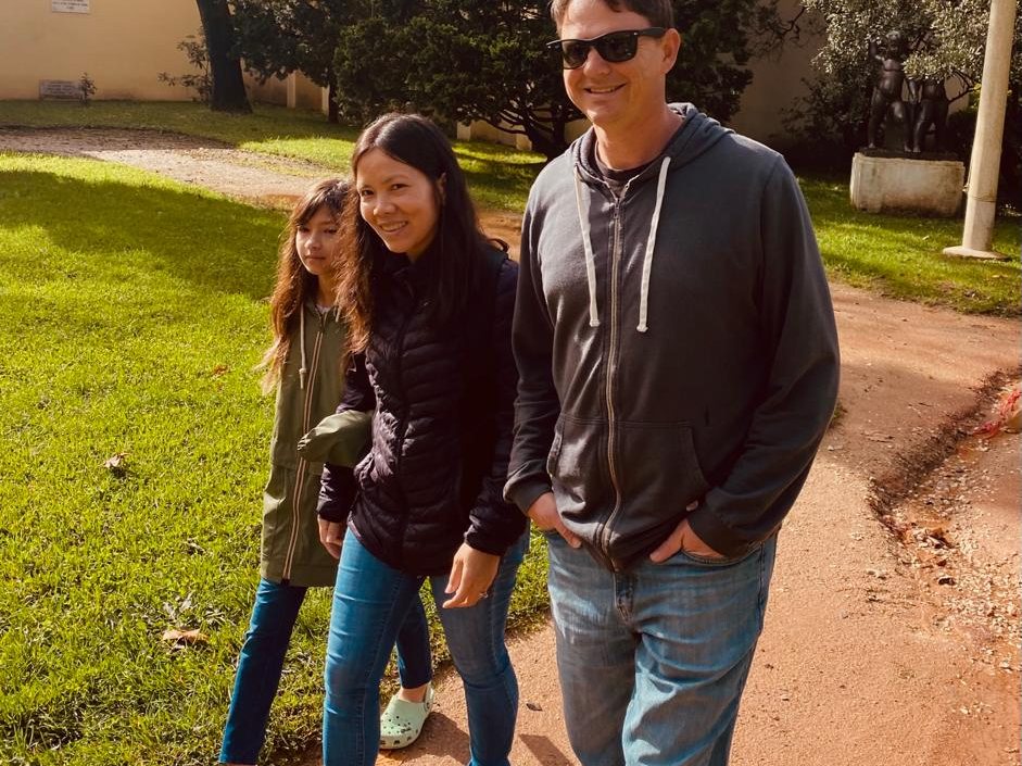 Family walking together outside in afternoon light