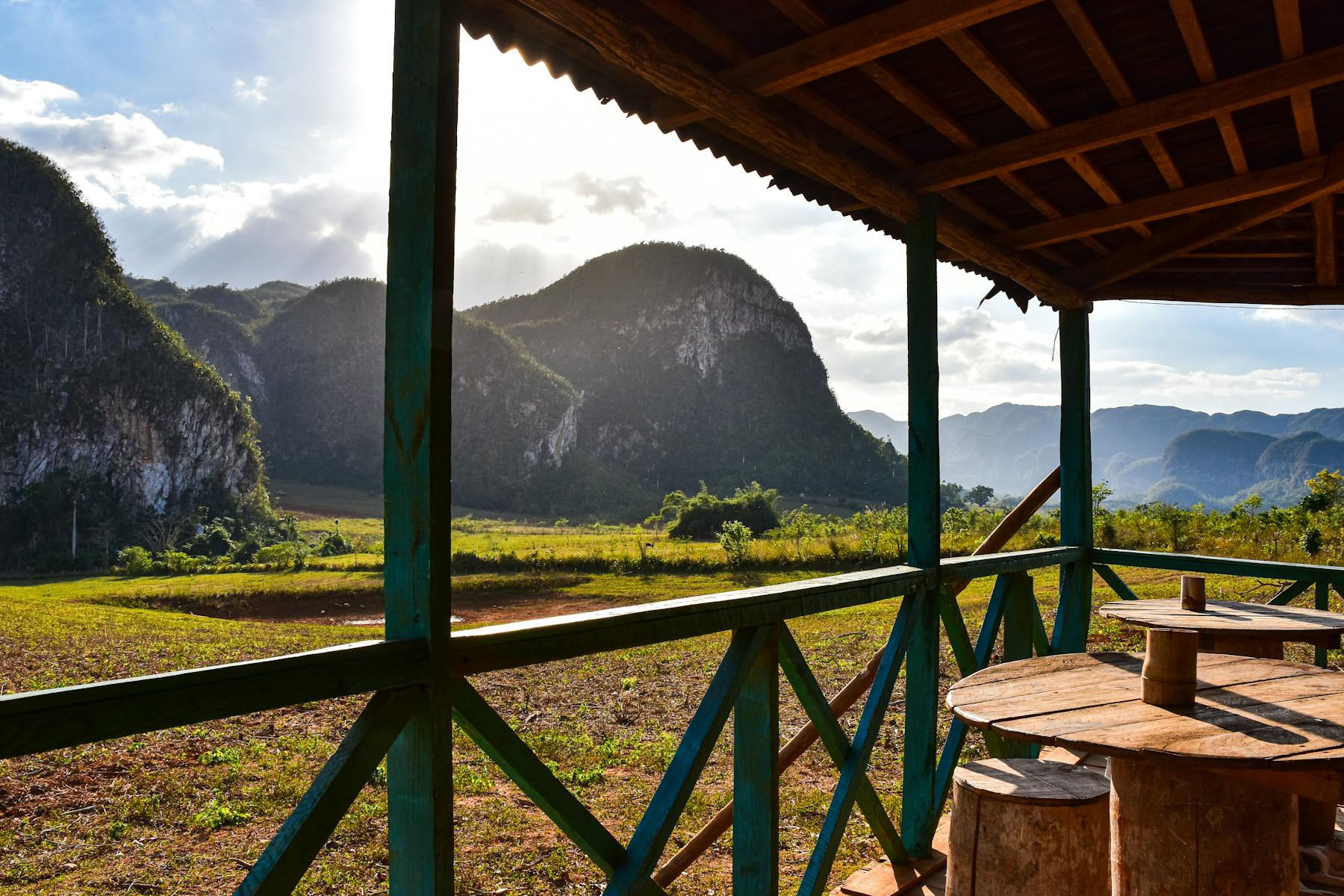 A quiet porch with simple seating and soft morning light